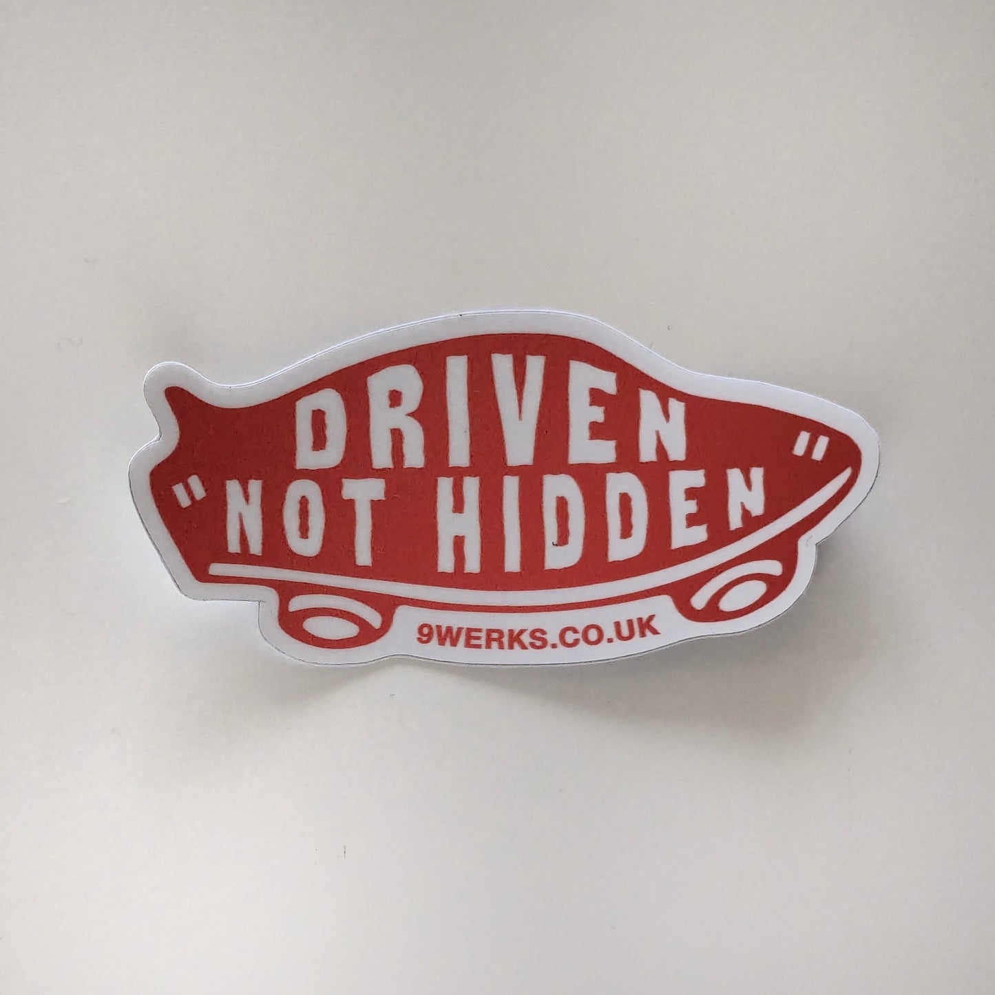 'Driven not hidden' red skateboard sticker