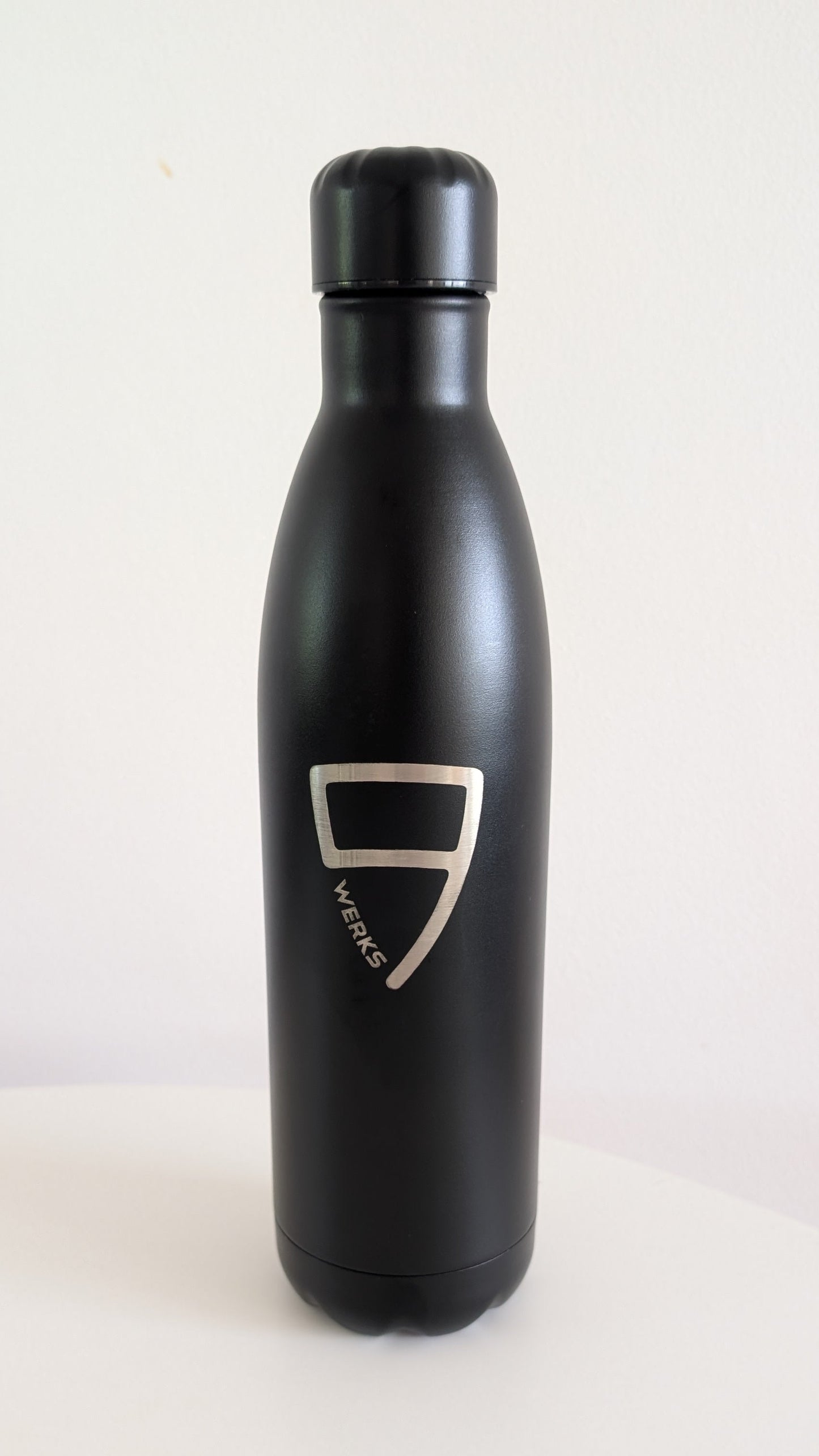 Black water bottle with a logo on a white background